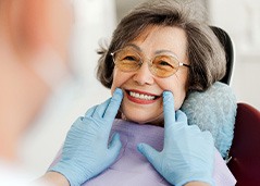 Dentist looking at patient's smile