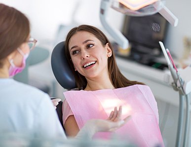 Woman smiling in the dental chair