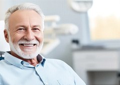 man smiling in the dentist chair
